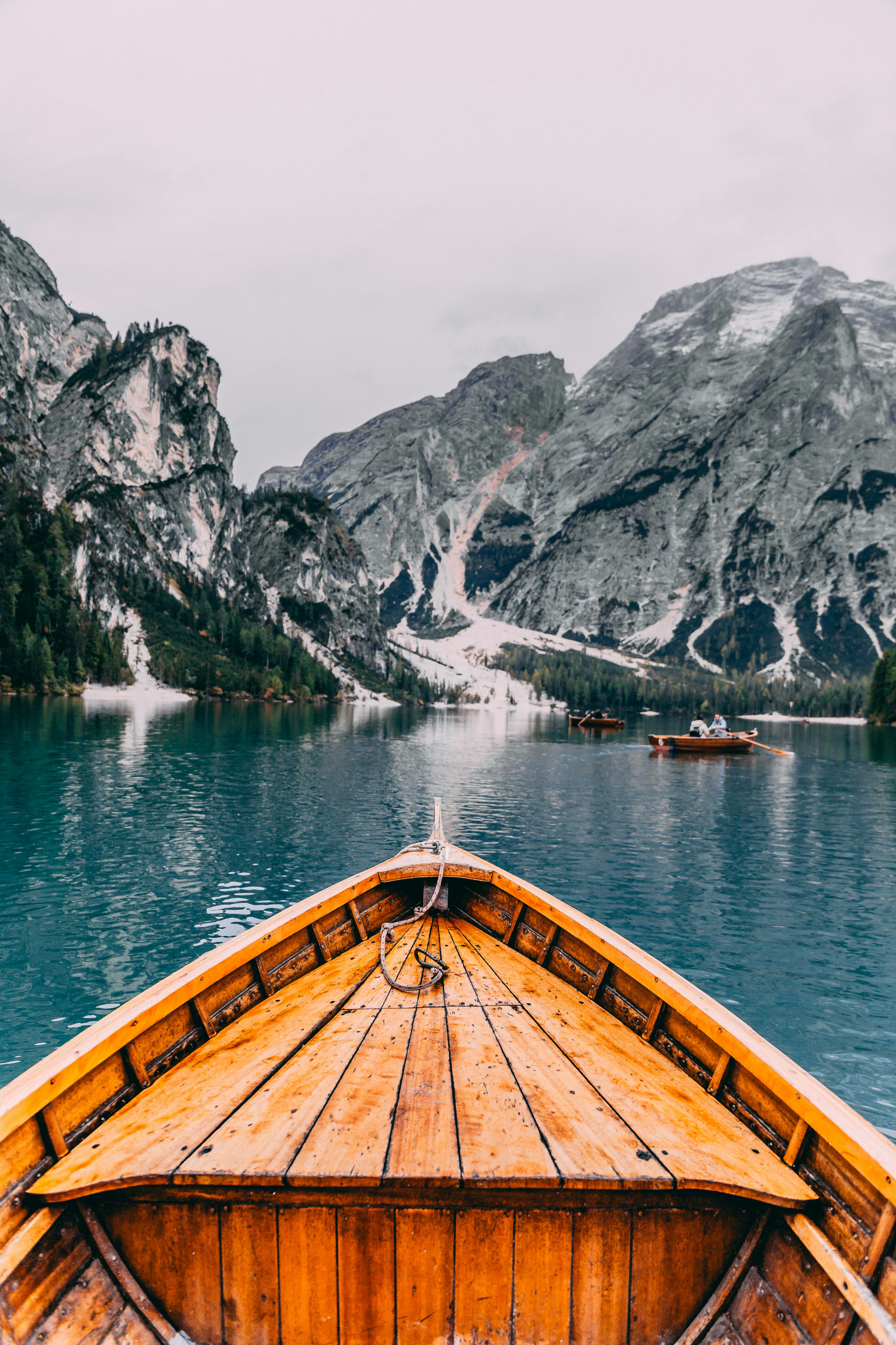 people in brown wooden boat